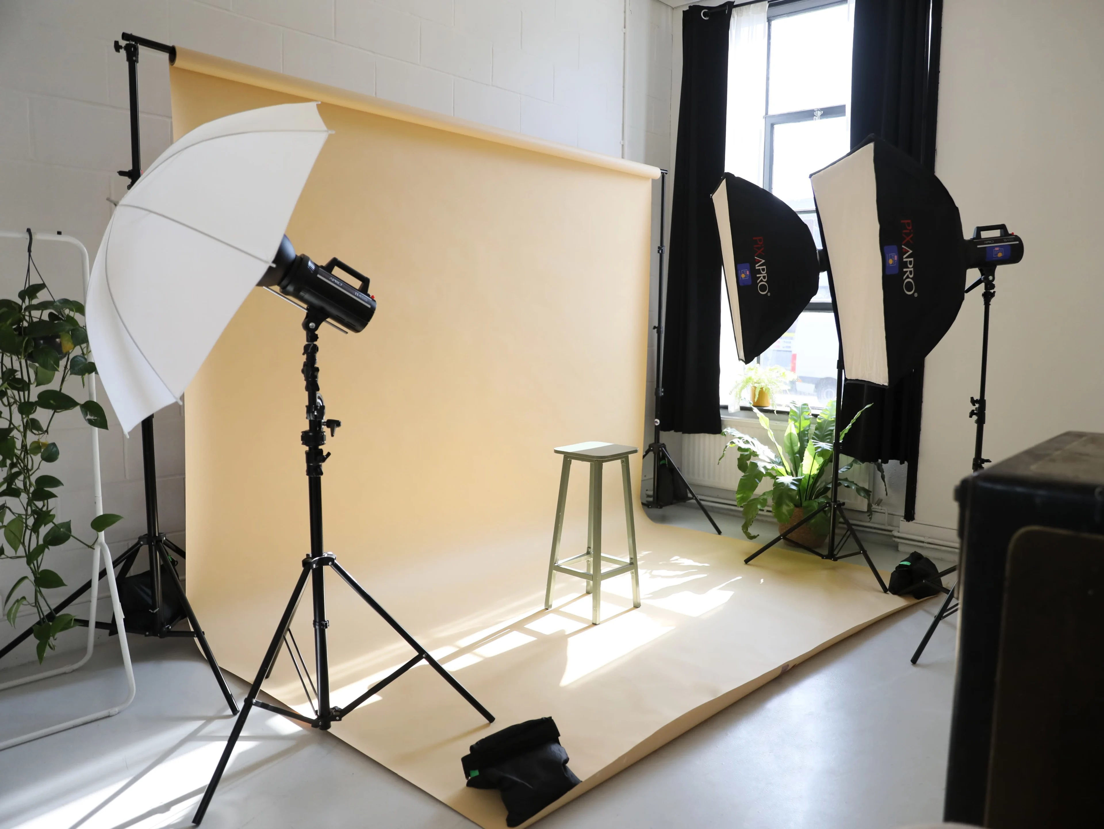 Professional camera and photography accessories prepared for a studio portrait session