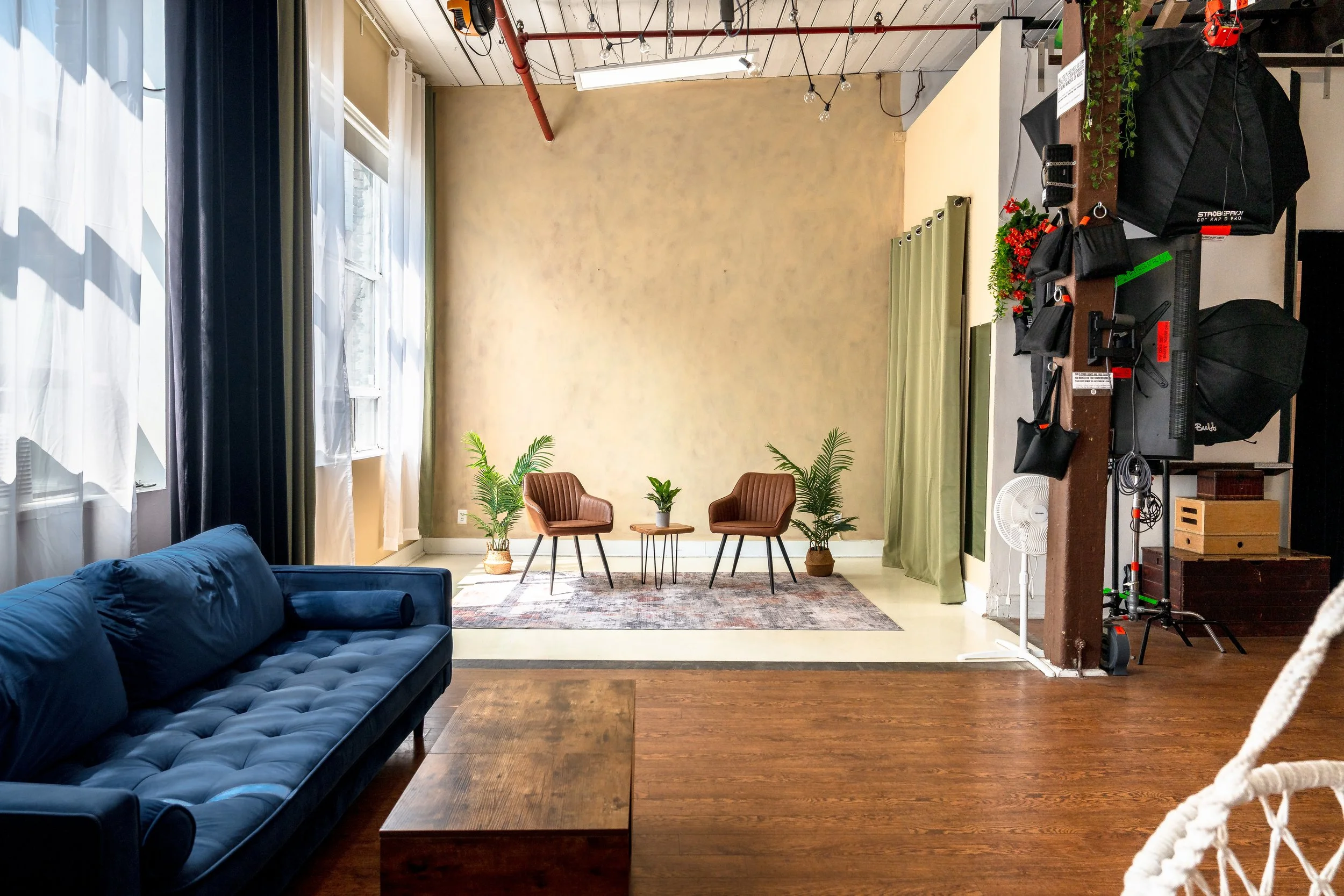 Professional photography equipment and carefully arranged studio portraits in an editorial composition